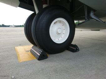 RAYFLEX AIRCRAFT WHEEL WITH CHOCKS IN PLACE